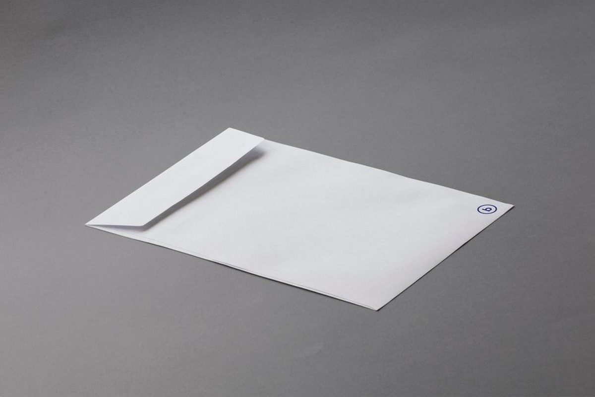 A simple white envelope on a neutral surface
